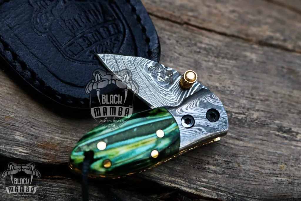 BMK-415-GR Green Tsetse Fly 3.5″ Long 1.5″Blade” 2oz Damascus Neck Knives Handmade Damascus Pocket Folding Knife With Mammoth Tooth Handle Black Mamba Hand Made World Class Knives USA Made - Image 2