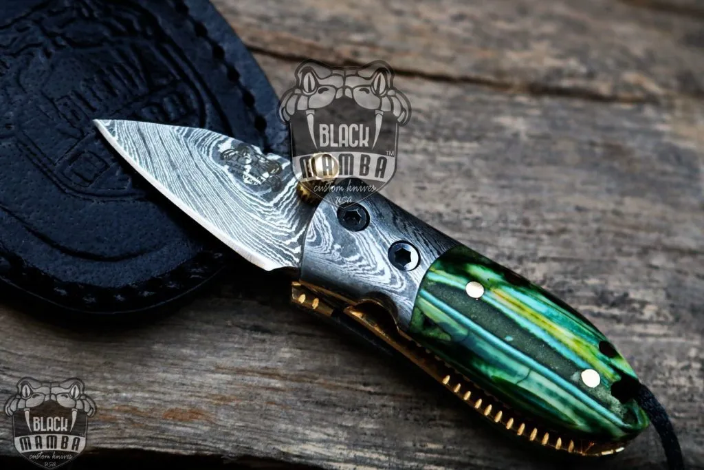 BMK-415-GR Green Tsetse Fly 3.5″ Long 1.5″Blade” 2oz Damascus Neck Knives Handmade Damascus Pocket Folding Knife With Mammoth Tooth Handle Black Mamba Hand Made World Class Knives USA Made - Image 3