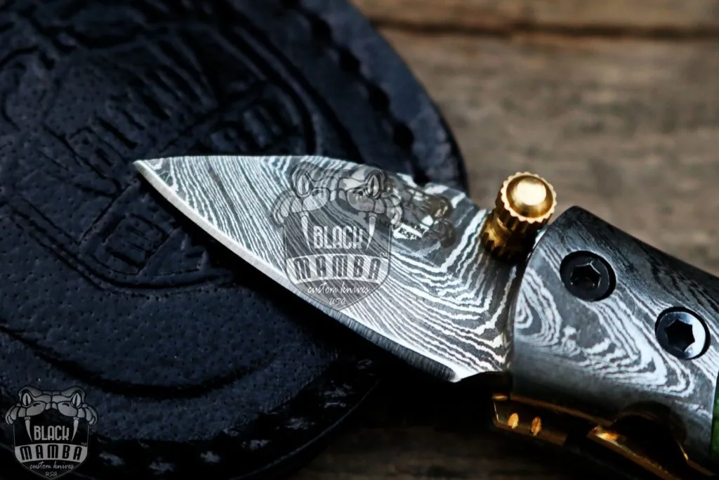BMK-415-GR Green Tsetse Fly 3.5″ Long 1.5″Blade” 2oz Damascus Neck Knives Handmade Damascus Pocket Folding Knife With Mammoth Tooth Handle Black Mamba Hand Made World Class Knives USA Made - Image 6
