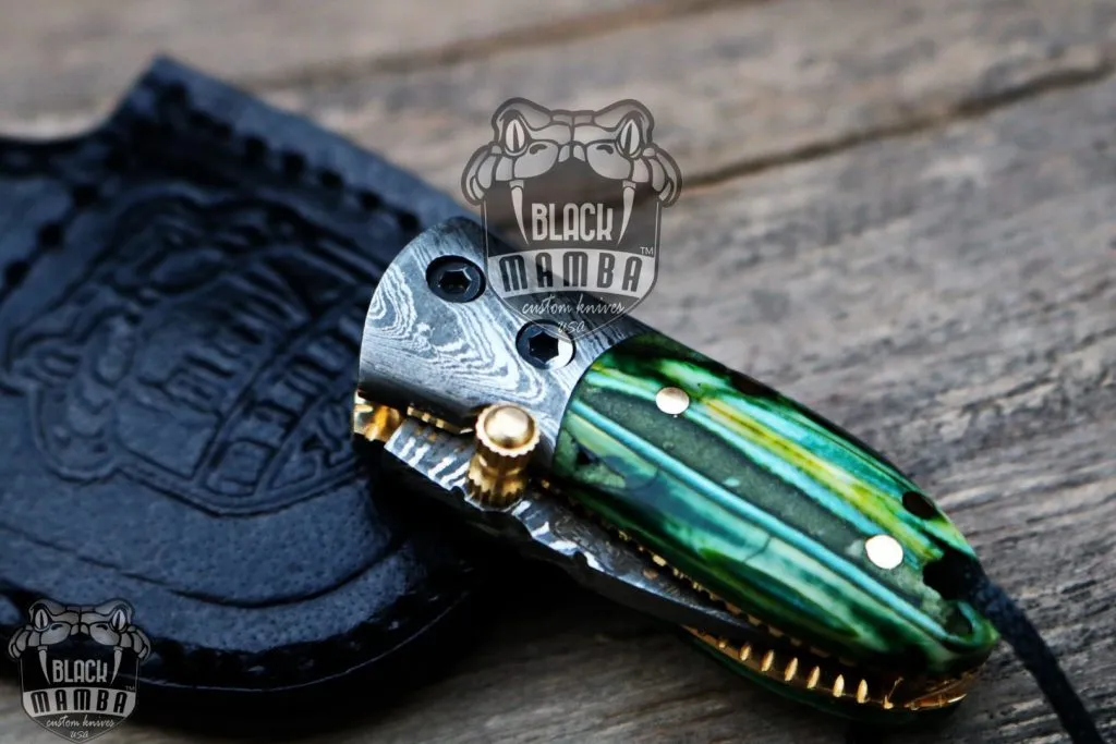 BMK-415-GR Green Tsetse Fly 3.5″ Long 1.5″Blade” 2oz Damascus Neck Knives Handmade Damascus Pocket Folding Knife With Mammoth Tooth Handle Black Mamba Hand Made World Class Knives USA Made - Image 9