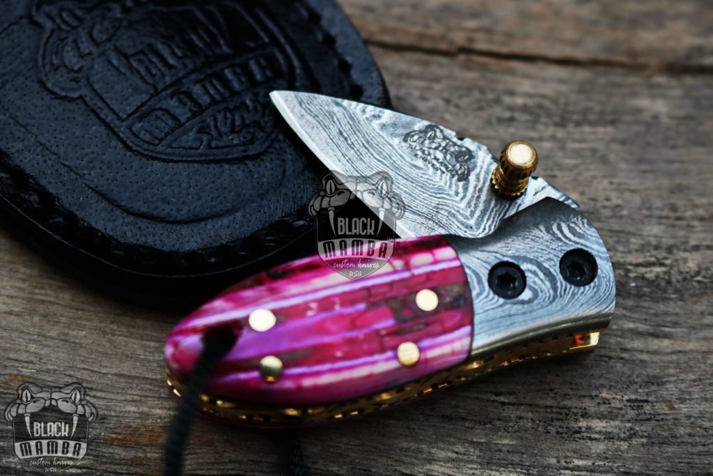 BMK-415-PK Pink Tsetse Fly 3.5″ Long 1.5″Blade” 2oz Damascus Neck Knives Handmade Damascus Pocket Folding Knife With Mammoth Tooth Handle Black Mamba Hand Made World Class Knives USA Made - Image 2