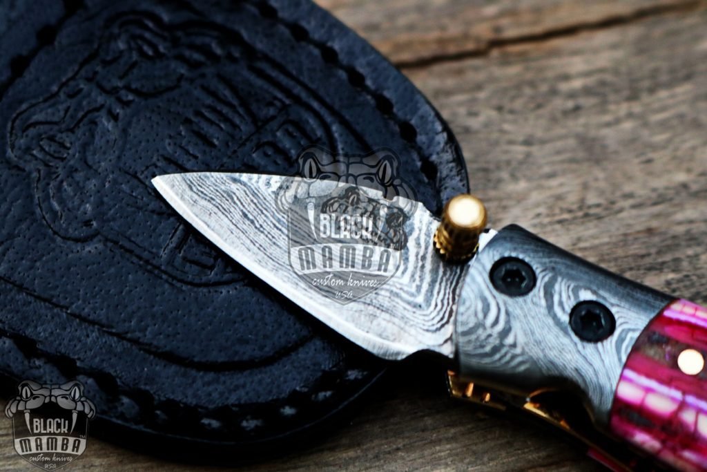BMK-415-PK Pink Tsetse Fly 3.5″ Long 1.5″Blade” 2oz Damascus Neck Knives Handmade Damascus Pocket Folding Knife With Mammoth Tooth Handle Black Mamba Hand Made World Class Knives USA Made - Image 5