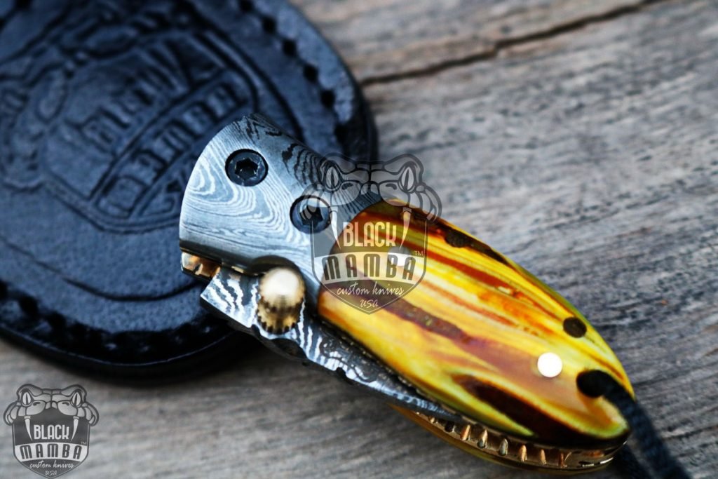 BMK-415YL Yellow Tsetse Fly 3.5″ Long 1.5″Blade” 2oz Damascus Neck Knives Handmade Damascus Pocket Folding Knife With Mammoth Tooth Handle Black Mamba Hand Made World Class Knives USA Made - Image 9