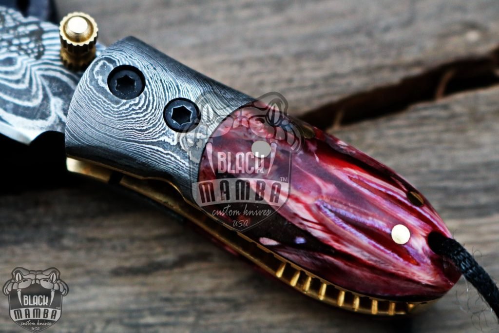 BMK-415-RD Red Tsetse Fly 3.5″ Long 1.5″Blade” 2oz Damascus Neck Knives Handmade Damascus Pocket Folding Knife With Mammoth Tooth Handle Black Mamba Hand Made World Class Knives USA Made - Image 5