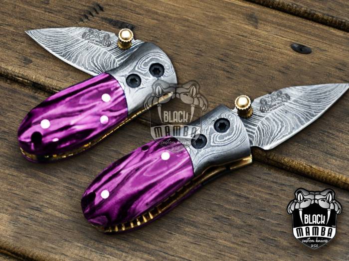 BMK-415-PK Pink Tsetse Fly 3.5″ Long 1.5″Blade” 2oz Damascus Neck Knives Handmade Damascus Pocket Folding Knife With Mammoth Tooth Handle Black Mamba Hand Made World Class Knives USA Made