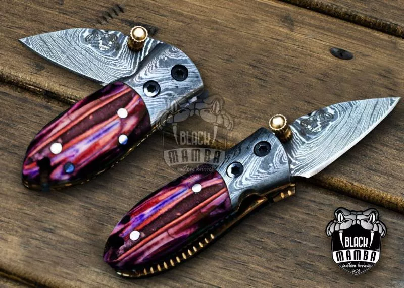 BMK-415-RD Red Tsetse Fly 3.5″ Long 1.5″Blade” 2oz Damascus Neck Knives Handmade Damascus Pocket Folding Knife With Mammoth Tooth Handle Black Mamba Hand Made World Class Knives USA Made