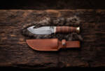 Old Guard D2 gut hook hunting knife with stacked leather handle, brass guard and pommel