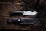 Midnight Horn satin D2 gut hook hunting knife with polished buffalo horn handle, stainless bolster and black leather sheath
