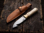 Chalk Meadow satin D2 gut hook hunting knife with camel bone handle, brass bolster and tan leather sheath