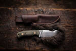 Fernline satin D2 gut hook hunting knife with olive green Micarta handle, brass pins and leather sheath