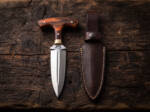 Bronze Fist mirror polished D2 push dagger with rosewood T-handle, brass bolster and dark brown leather sheath