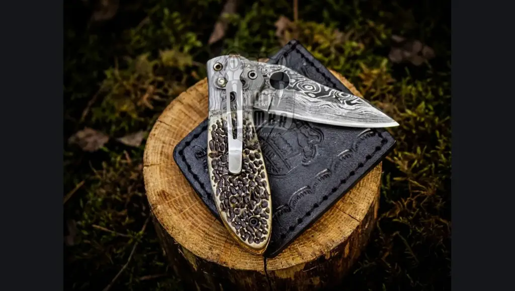 Damascus knife in a gift box with pine sprigs and warm candlelight