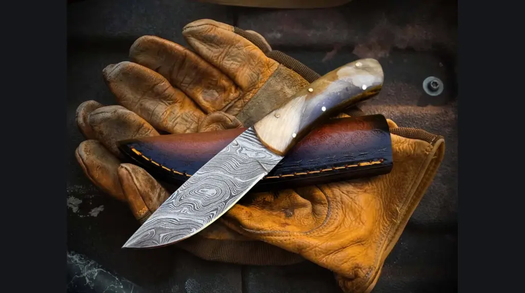 Macro view of forge-welded Damascus layers in a knife blade