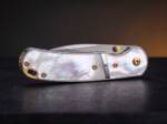 Golden Nacre Damascus ladies folding knife with mother of pearl handle, steel bolsters and brass pocket clip