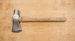 Homestead Oak hand forged 1095 high carbon steel tomahawk axe with hammer poll and 19 inch straight American oak haft on a workbench