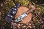 Amber Sovereign mirror polished D2 steel Tom Brown style tracker knife with rosewood handle and gold stainless screws