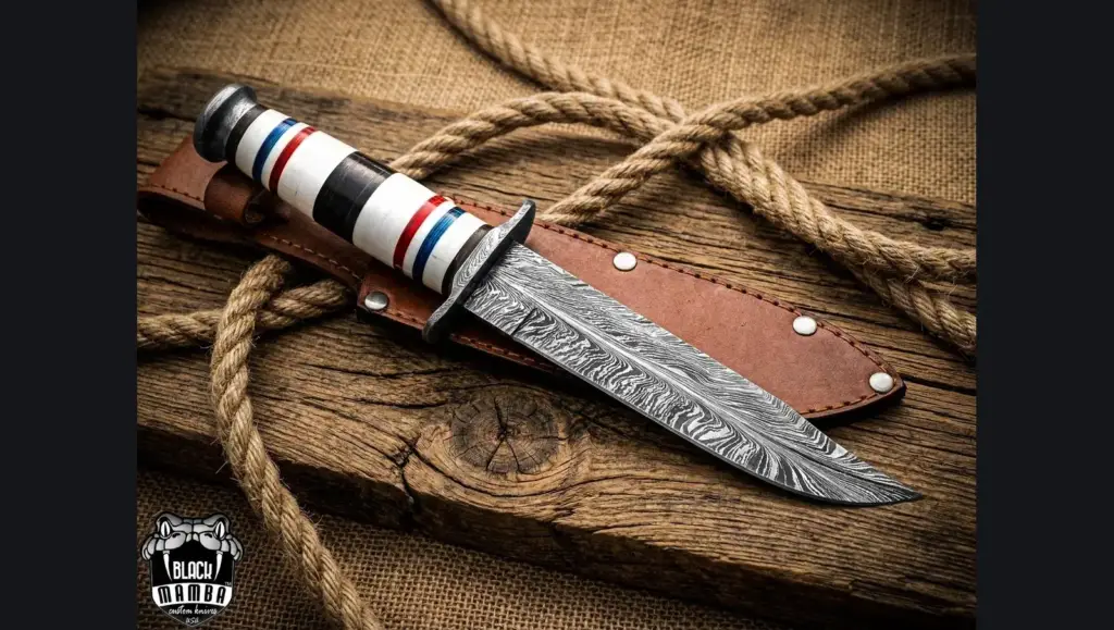 Stacked leather handle Damascus knife with sheath on an olive wool blanket